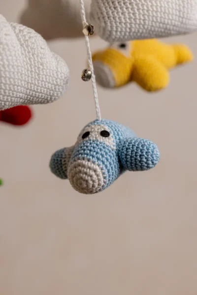Crochet airplane cot hanging showing full mobile width with multiple colourful aircraft handmade nursery decor Australia