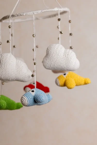 Crochet airplane cot hanging showing full mobile width with multiple colourful aircraft handmade nursery decor Australia