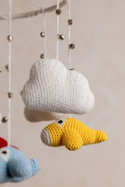 Crochet airplane cot hanging showing full mobile width with multiple colourful aircraft handmade nursery decor Australia