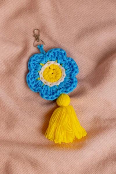 Handmade crochet blue flower keyring with soft petals made by artisan crafters Australia