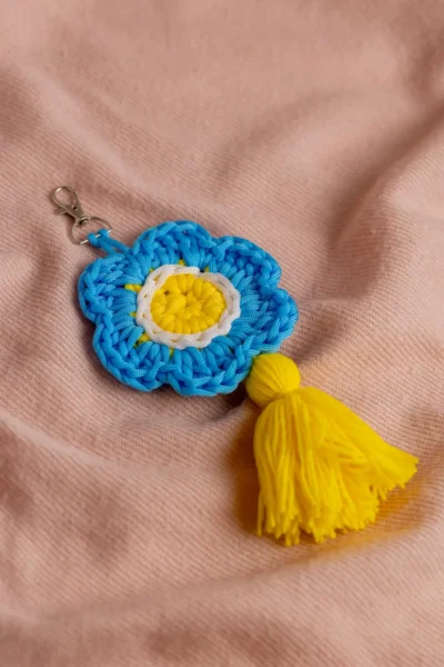 Handmade crochet blue flower keyring with soft petals made by artisan crafters Australia