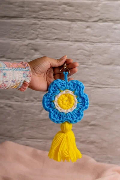 Handmade crochet blue flower keyring with soft petals made by artisan crafters Australia