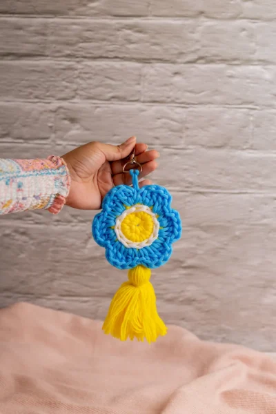 Handmade crochet blue flower keyring with soft petals made by artisan crafters Australia