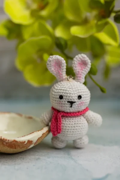 Handmade crochet bunny keyring with floppy ears and stitched face made by artisan crafters Australia