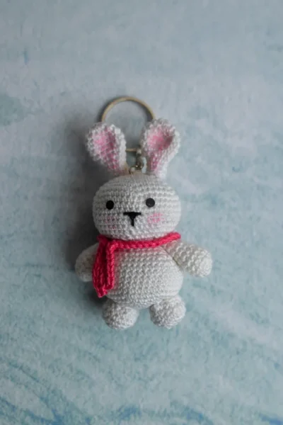 Handmade crochet bunny keyring with floppy ears and stitched face made by artisan crafters Australia