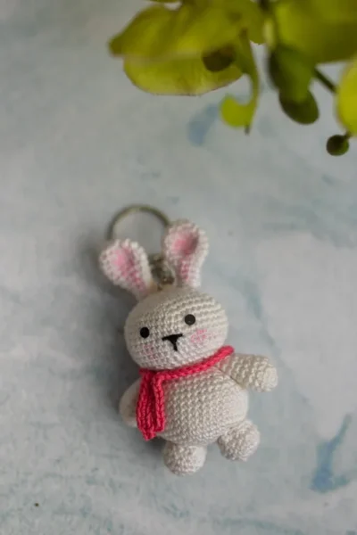 Handmade crochet bunny keyring with floppy ears and stitched face made by artisan crafters Australia