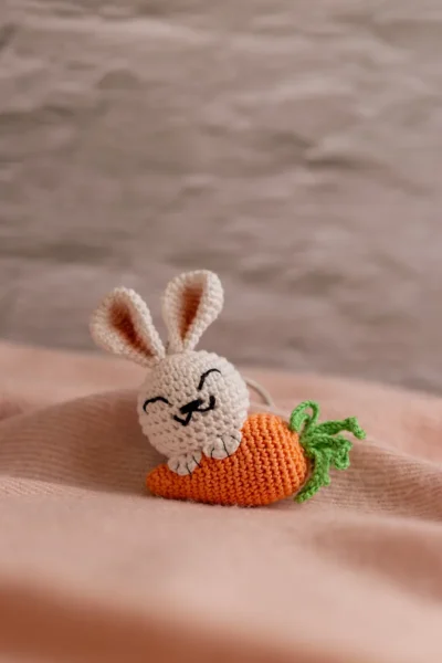 Handmade crochet white bunny holding orange carrot keyring made by artisan crafters Australia