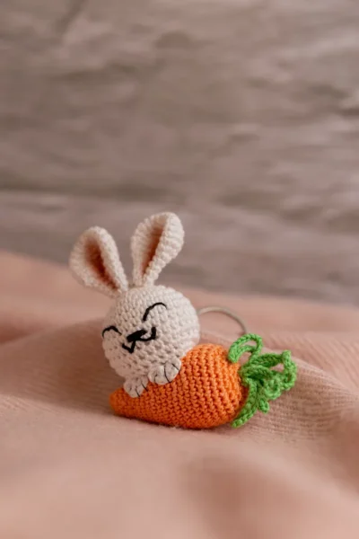 Handmade crochet white bunny holding orange carrot keyring made by artisan crafters Australia