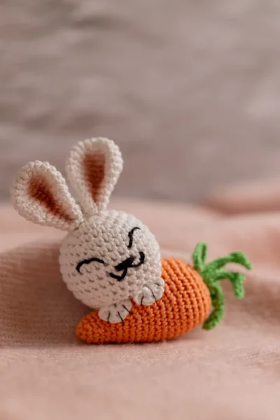 White crochet bunny with orange carrot keychain showing full charm detail handmade ethical gift Australia