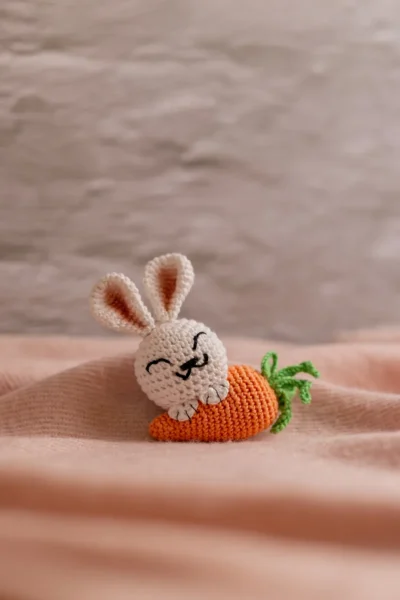 White crochet bunny with orange carrot keychain showing full charm detail handmade ethical gift Australia