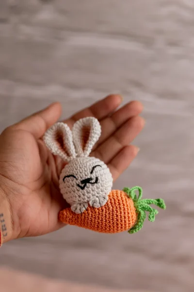 White crochet bunny with orange carrot keychain showing full charm detail handmade ethical gift Australia