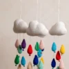 Crochet cloud and raindrops cot hanging showing full mobile with colourful raindrop strands handmade ethical nursery decor Australia