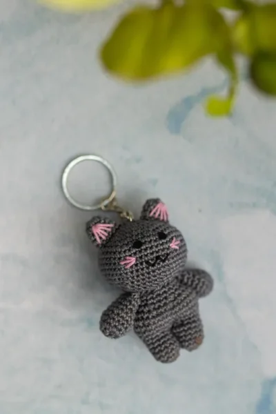 Miniature crochet doll keyring clipped to bag handmade by artisan crafters unique gift for women Australia