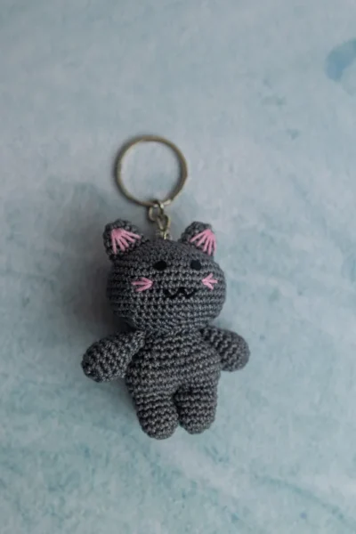 Miniature crochet doll keyring clipped to bag handmade by artisan crafters unique gift for women Australia