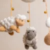 Crochet dreamy sheep cot hanging showing full mobile with fluffy white sheep and gentle cloud motifs handmade nursery decor Melbourne