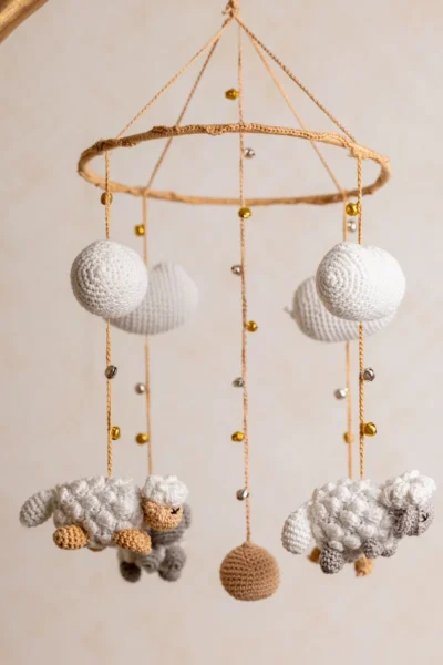 Crochet dreamy sheep mobile with soft white sheep and cloud accents gentle movement handmade by artisan women in India