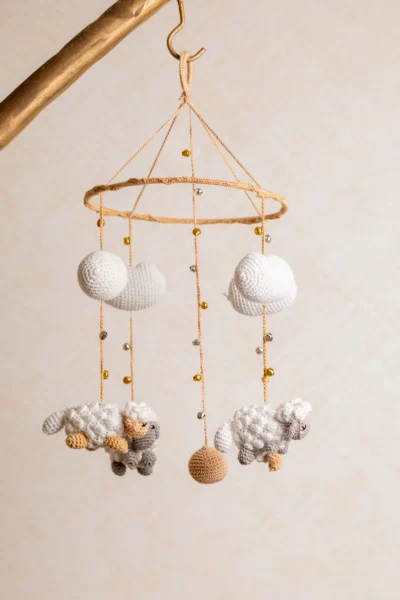 Crochet dreamy sheep mobile with soft white sheep and cloud accents gentle movement handmade by artisan women in India