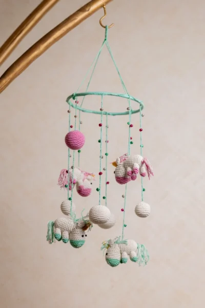 Pink and green unicorn crochet nursery mobile shown in nursery handmade baby shower gift unique colour Melbourne Australia