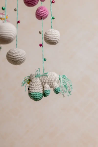 Pink and green unicorn crochet nursery mobile shown in nursery handmade baby shower gift unique colour Melbourne Australia