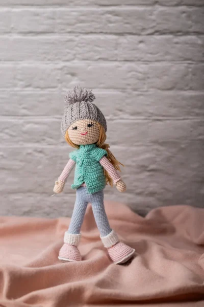 Handmade crochet amigurumi winter doll wearing cosy hat coat and scarf made by artisan crafters soft toy gift Australia