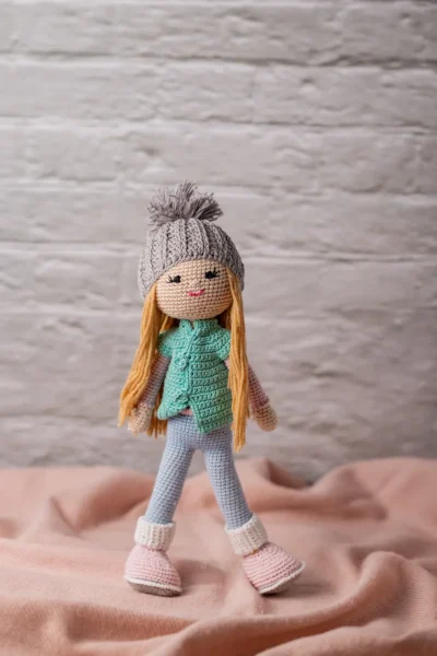 Handmade crochet amigurumi winter doll wearing cosy hat coat and scarf made by artisan crafters soft toy gift Australia