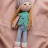 Handmade crochet amigurumi winter doll wearing cosy hat coat and scarf made by artisan crafters soft toy gift Australia