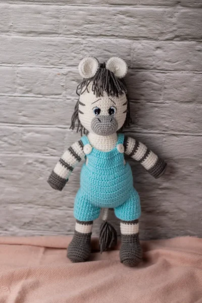 Handmade crochet amigurumi zebra toy with black and white stripe pattern made by artisan crafters soft toy gift Australia