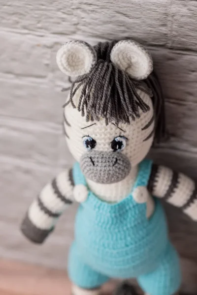 Handmade crochet amigurumi zebra toy with black and white stripe pattern made by artisan crafters soft toy gift Australia