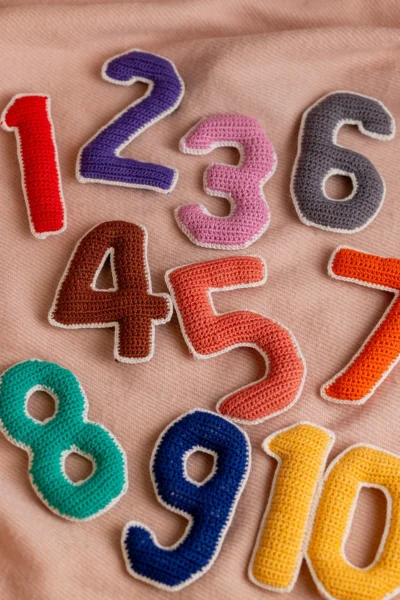 Crochet numbers set 1 to 10 laid out showing all colourful individual number pieces handmade counting toy Melbourne