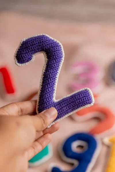 Crochet numbers set 1 to 10 laid out showing all colourful individual number pieces handmade counting toy Melbourne