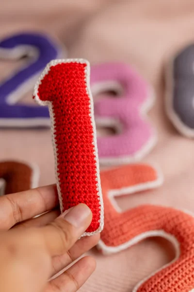 Crochet numbers set 1 to 10 laid out showing all colourful individual number pieces handmade counting toy Melbourne