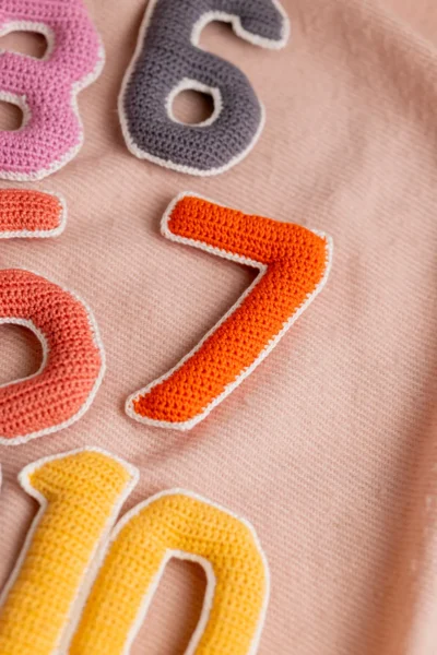 Crochet numbers set 1 to 10 laid out showing all colourful individual number pieces handmade counting toy Melbourne