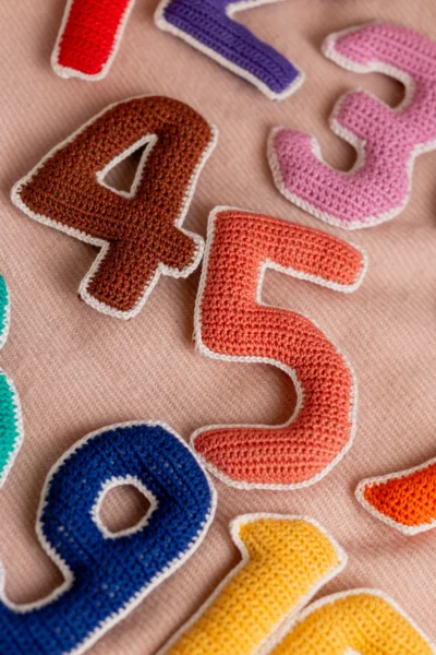 Crochet numbers set 1 to 10 laid out showing all colourful individual number pieces handmade counting toy Melbourne