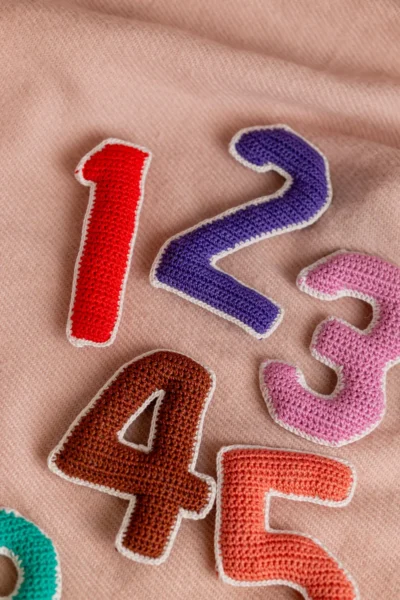 Crochet numbers set 1 to 10 laid out showing all colourful individual number pieces handmade counting toy Melbourne
