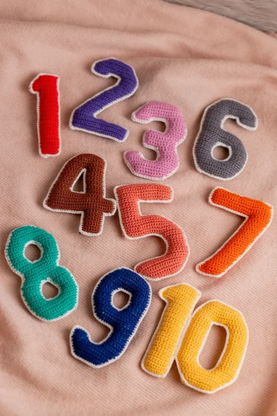 Crochet numbers set 1 to 10 laid out showing all colourful individual number pieces handmade counting toy Melbourne