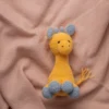 Handmade crochet Ingu giraffe soft toy with yellow and brown spot pattern long neck and gentle stitched face artisan made Australia