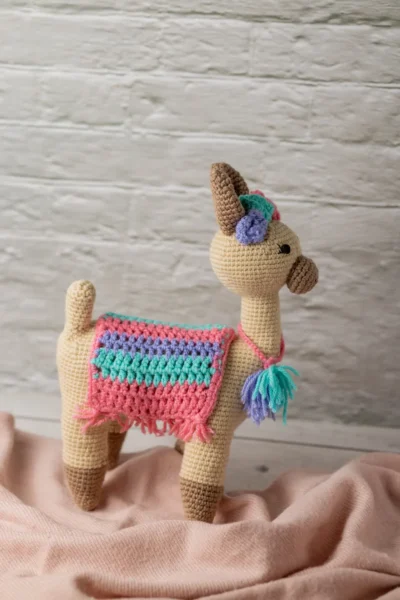 Handmade crochet amigurumi llama toy with chunky fluffy texture friendly face and soft yarn body ethical kids gift Australia