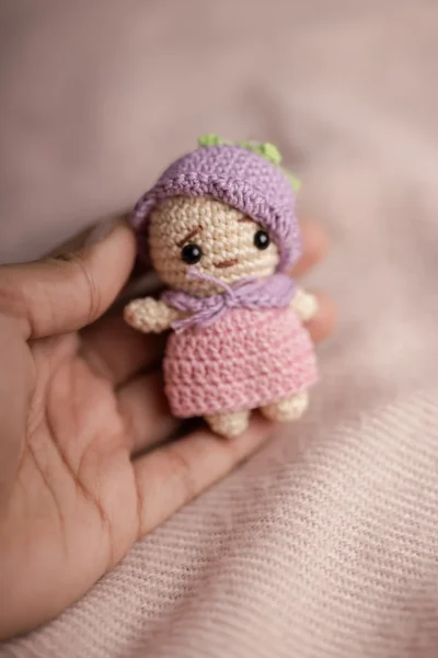 Handmade crochet mini doll keyring with pink hair and purple dress made by artisan crafters Australia