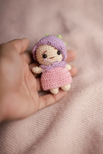 Small amigurumi pink and purple doll keychain showing full doll detail handmade ethical bag charm Australia