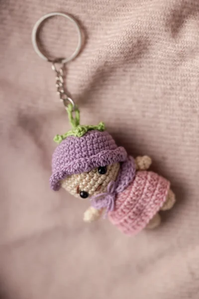 Small amigurumi pink and purple doll keychain showing full doll detail handmade ethical bag charm Australia