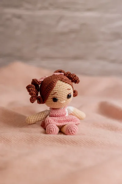Handmade crochet miniature amigurumi doll small soft toy with detailed yarn features made by artisan crafters gift Australia