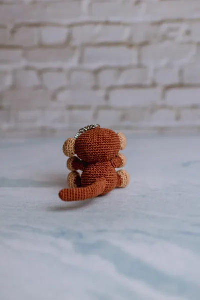 Brown crochet monkey keychain showing full monkey figure handmade ethical gift for animal lovers Australia