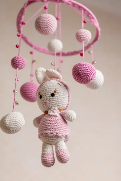 Handmade crochet pink bunny nursery mobile with soft white and pink rabbit made by artisan women in India Australia