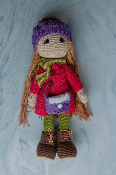 Handmade crochet Pollie doll wearing striped dress soft cotton yarn body and gentle stitched face made by artisan women in India gift Australia