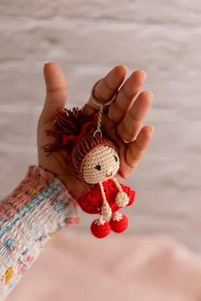 Handmade crochet little red dress charm keyring made by artisan crafters ethical gift Australia