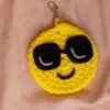 Yellow crochet happy face keyring clipped to keys handmade by artisan crafters shipped from Melbourne