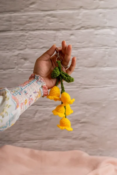 Yellow tulip crochet keychain showing petal detail and yellow yarn handmade ethical gift Australia