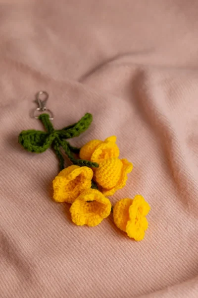 Yellow tulip crochet keychain showing petal detail and yellow yarn handmade ethical gift Australia