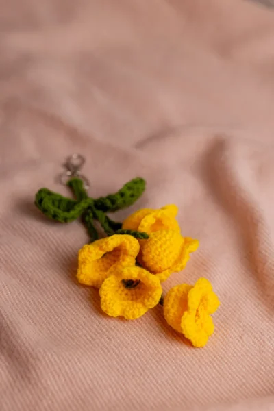 Yellow tulip crochet keychain showing petal detail and yellow yarn handmade ethical gift Australia