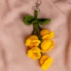 Handmade crochet yellow tulip flower keyring with green stem made by artisan crafters Australia